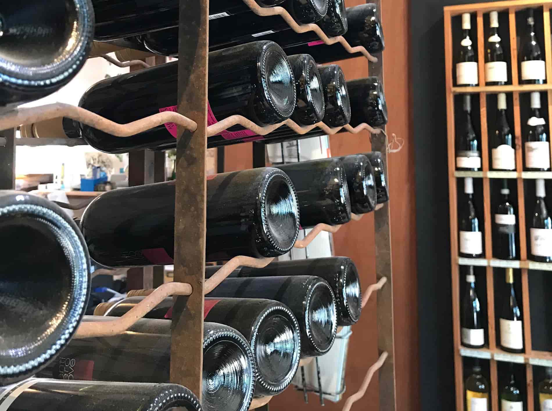 Wine bottles on display shelves inside the shop