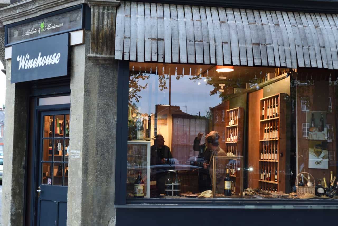 Winehouse Aleksic & Mortimer shop front at dusk, Dalston London